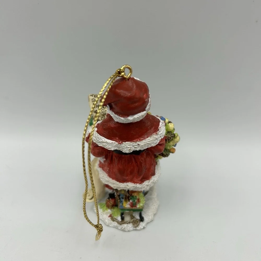The International‎ Santa Claus Collection 1997 African American Santa Flawed